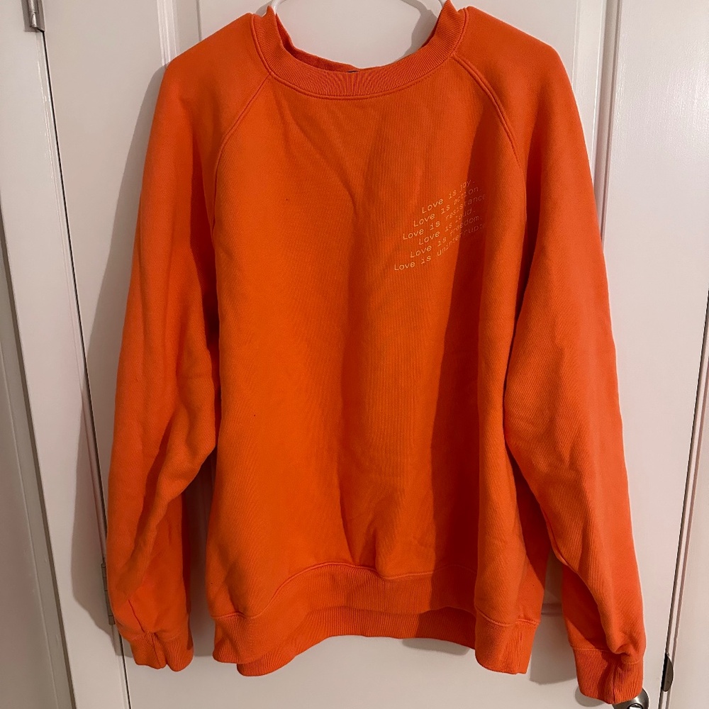 Uninterrupted orange crewneck